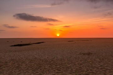 Fototapeta na wymiar Sunset at the beach in Santo Andre, Portugal