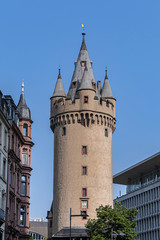 Fototapeta na wymiar Eschenheim Tower (Eschenheimer Turm) was a city gate, part of late-medieval fortifications of Frankfurt am Main - a landmark of city. Tower erected at the beginning of fifteenth century. Germany.