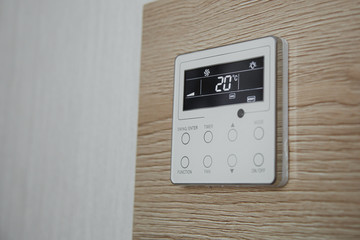 air conditioner screen on the wall that shows an air temperature of 20 degrees Celsius