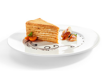 Medovik slice in white plate