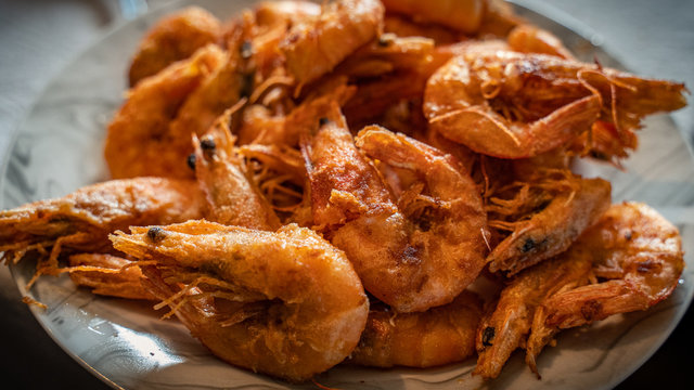 fresh crunchy fried shrimps plate close up