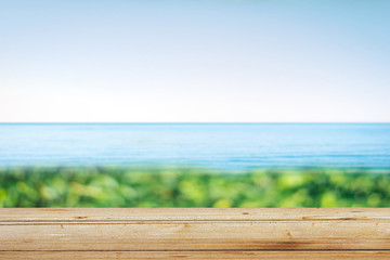 Fototapeta premium Wooden table on the beach