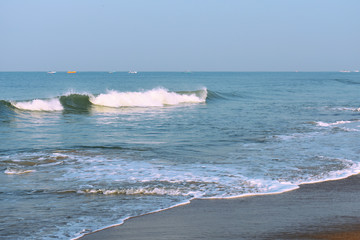 waves of the blue ocean with a blue sky