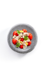 Ravioli with crab meat and tomato mousse top view