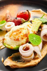 Grilled squid with avocado and egg