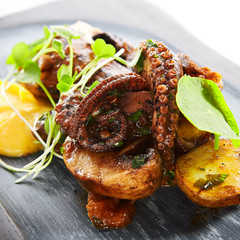 Grilled octopus with baked potatoes
