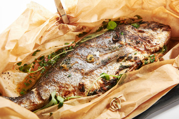 Baked dorado fish in parchment