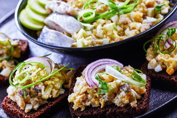 Minced herring with apple and egg on rye bread