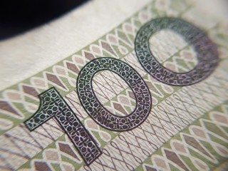 Macro (PLN) Polish 100 zloty banknotes background. One hundred zloty banknotes. close-up photo. Narodowy Bank Polski