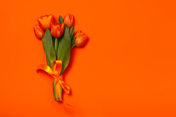 Bouquet of tulips in orange and rich red colors. Concept of Women's Day, Mother's Day, 8 March, the...