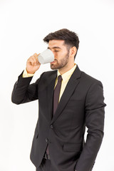 A handsome businessman standing over a coffee isolated on white background,