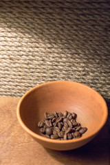 A handful of coffee beans. Grade Arabica. Hot coffee drink. Strong espresso. Grains of medium frying. The menu in the coffee shop. Fragrant drink. Coffee bean close-up. An invigorating morning drink.