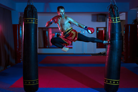 Muay Thai Fighter Working With Heavy Bag