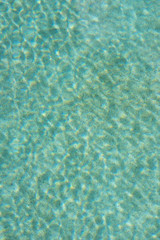 Blue torn water in pool. Water surface background.. 