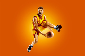 bright professional basketball player on an orange background