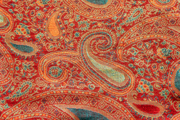 Indian floral paisley pattern with stylized blue and red flowers, closeup. Design for textile, cover, backdrop, fabric