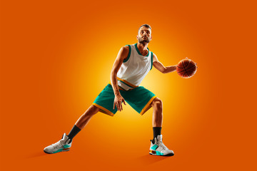 bright professional basketball player on an orange background