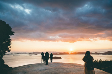 couple walking on the beach at sunset