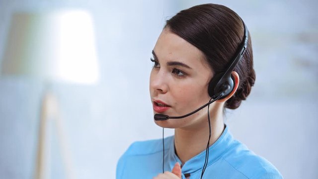 businesswoman in headset talking in call center