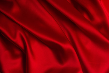 Red silk or satin luxury fabric texture can use as abstract background.