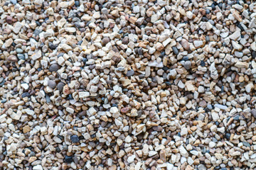 dry small river gravel with beautiful and colorful texture for gardening and pathways decorative construction by close up view