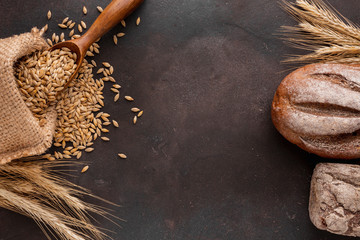Wheat seeds and bread flat lay