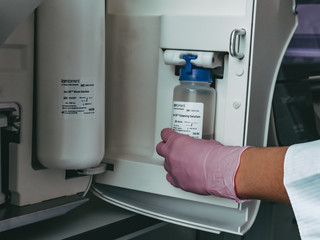 chemical laboratory, a jar of reagent is inserted into the device, technology