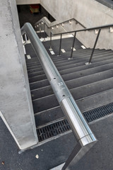 quay mark in braille dots on the stairs of a Léman Express station in Geneva, Switzerland