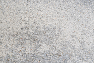 White surface texture of the old cement wall that peels off close-up background.