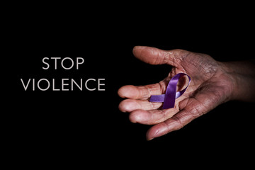 purple ribbon and text stop violence