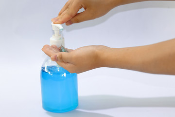 hand gel alcohol, hand sanitizer in pump bottle with hands and white background.