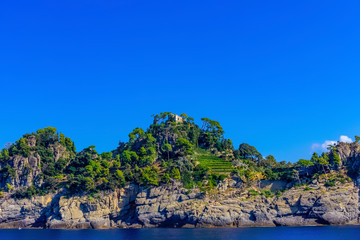 Old medieval castle, located on a hill near harbor of Portofino town, Italy