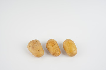 Potatoes over white background. Food concept