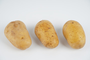 Potatoes over white background. Food concept