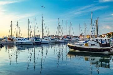 Fototapeta premium Harbor with docked boats in Porec town on Adriatic sea in Croatia, Europe.