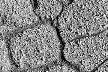 Texture of gray cracked asphalt. Abstract background for design.