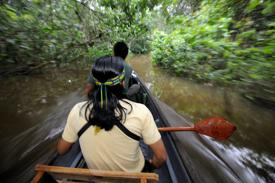 People in a boat on Amazon rainforest river