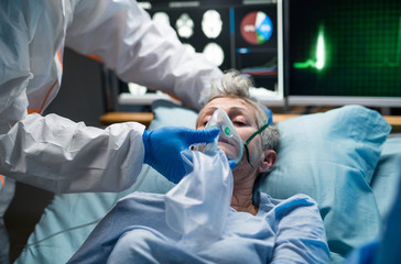 Infected patient in quarantine lying in bed in hospital, coronavirus concept.