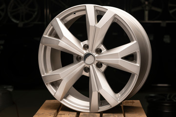 silvery new cast aluminum wheels on a black background close up