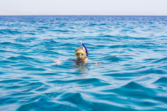 snorkeling female portrait in Red sea water activity summer time vacation season concept picture horizon background view