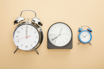 top view of clocks on blue background