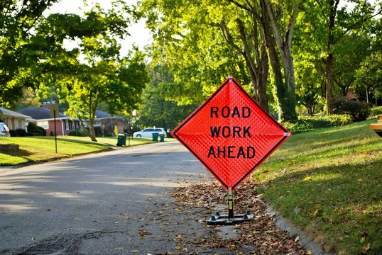 road work ahead construction sign in a residential neighborhood
