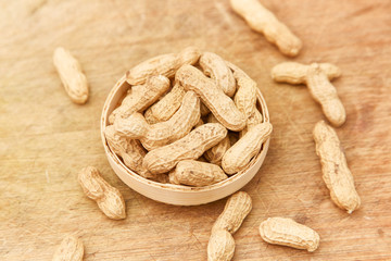 A pile of peanuts in a bamboo basket