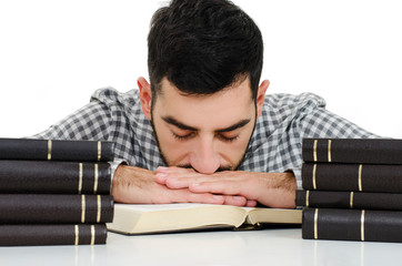 Obraz premium Guy fell asleep in the library on the books. Isolated on white background