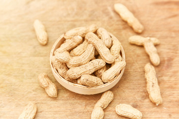 A pile of peanuts in a bamboo basket