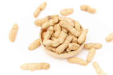 A pile of peanuts in a bamboo basket