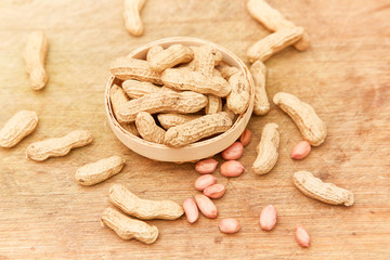 A pile of peanuts in a bamboo basket