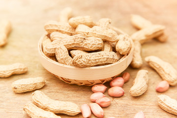 A pile of peanuts in a bamboo basket