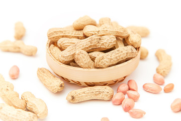 A pile of peanuts in a bamboo basket