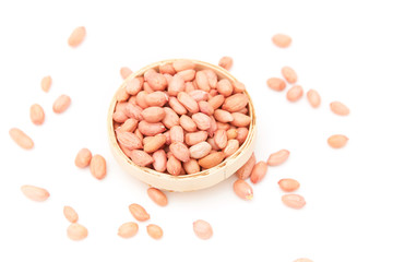 A pile of peanuts in a bamboo basket